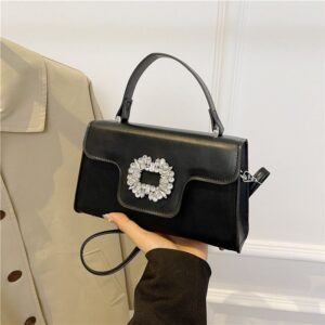 Bolso de mano, con diamantes al centro black color