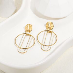Aretes geometricos tono blanco con gold redondos Acero